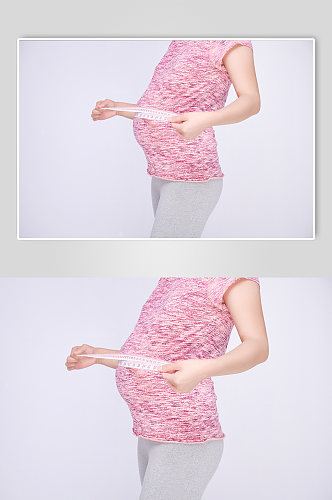 手拿量尺优雅孕妇人物摄影图
