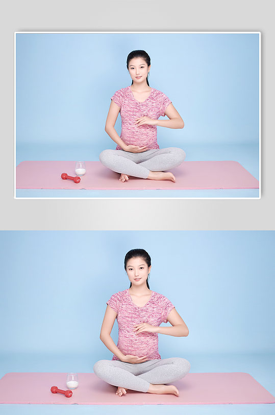 瑜伽垫手扶肚子孕妇瑜伽人物摄影图