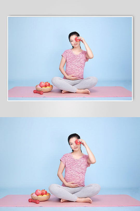 手拿苹果孕妇瑜伽人物摄影图