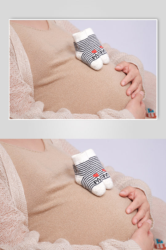 肚子放宝宝袜孕妇人物摄影图