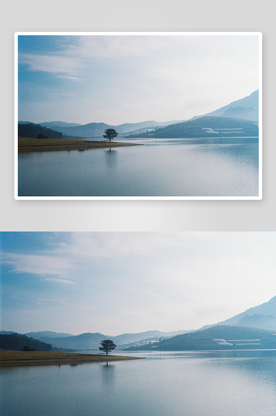 湖畔孤树远山静谧风光-众图网