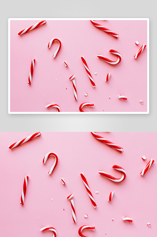 粉色背景上的红白拐杖糖-众图网