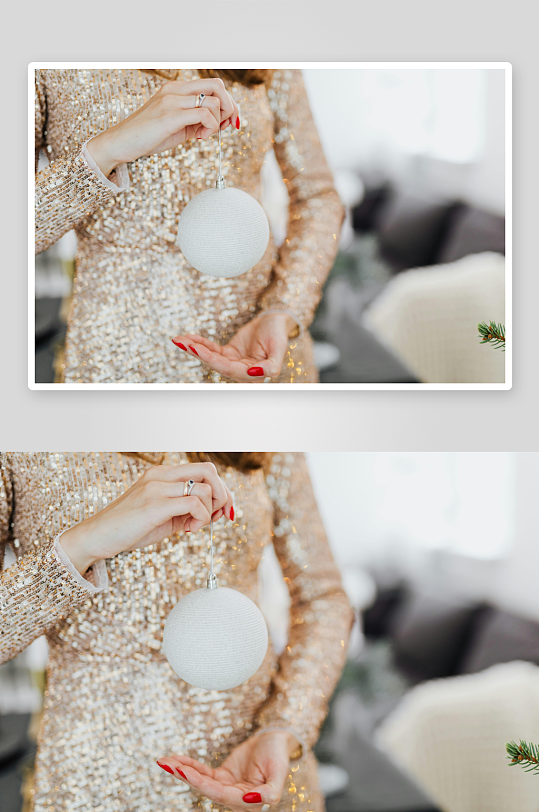 金装女子手持白色圣诞球-众图网