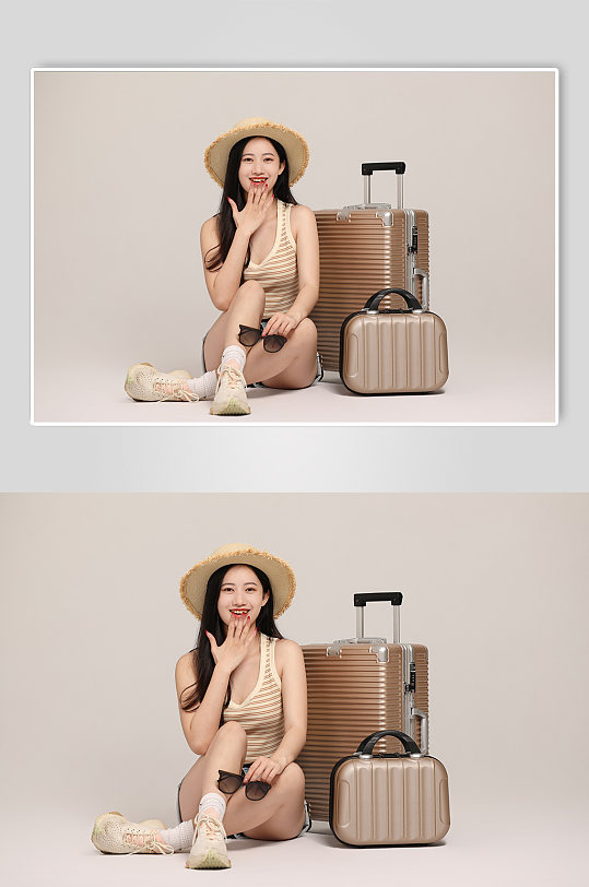 手拿墨镜坐在地上行李箱旅行人物摄影图片