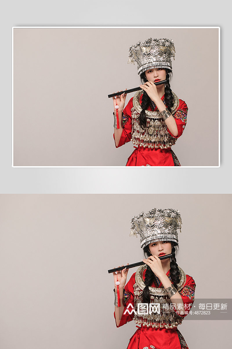 苗族少数民族少女吹笛银饰服饰摄影图片素材