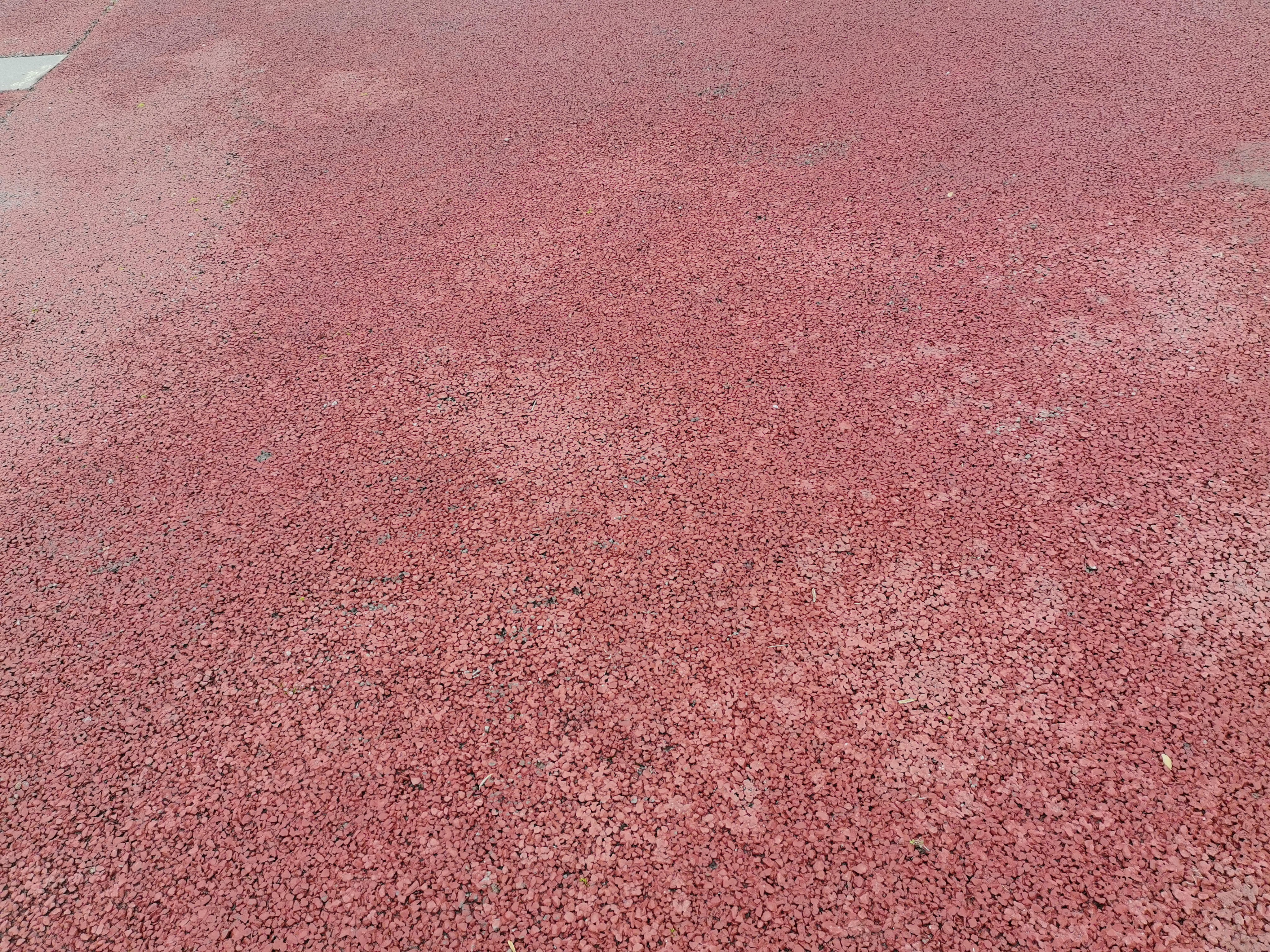 红色路面颗粒特写素材