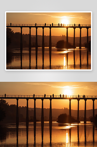 剪影人桥河对天空日落图片