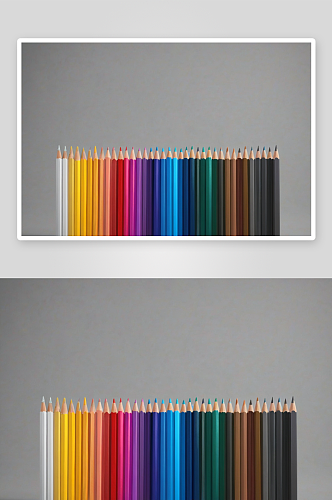 不同颜色铅笔并排灰色背景图片