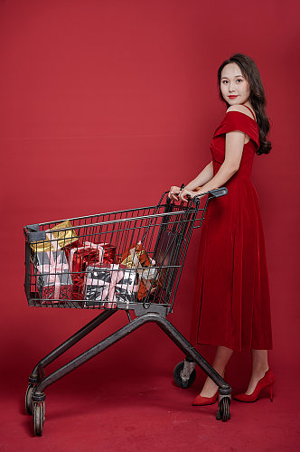 喜庆红裙女生新年礼物盒购物人物摄影图