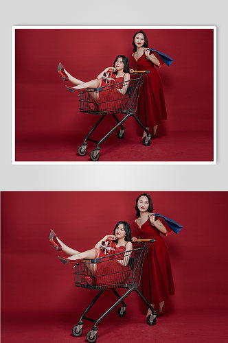 喜庆红裙女生双人超市购物车购物人物摄影图