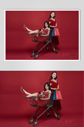 喜庆红色红裙女生双人购物人物摄影图照片