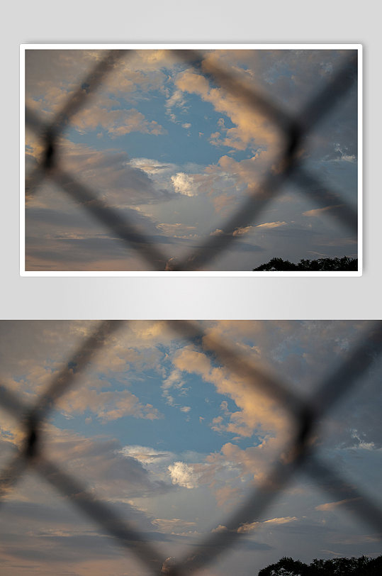 晚霞高清足球场围栏云朵背景图摄影图照片