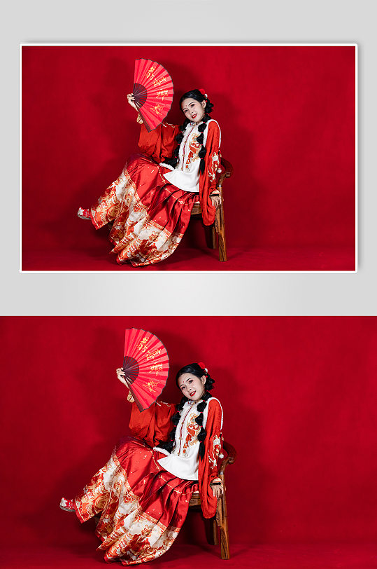 红色新年刺绣汉服女生折扇人物摄影图片