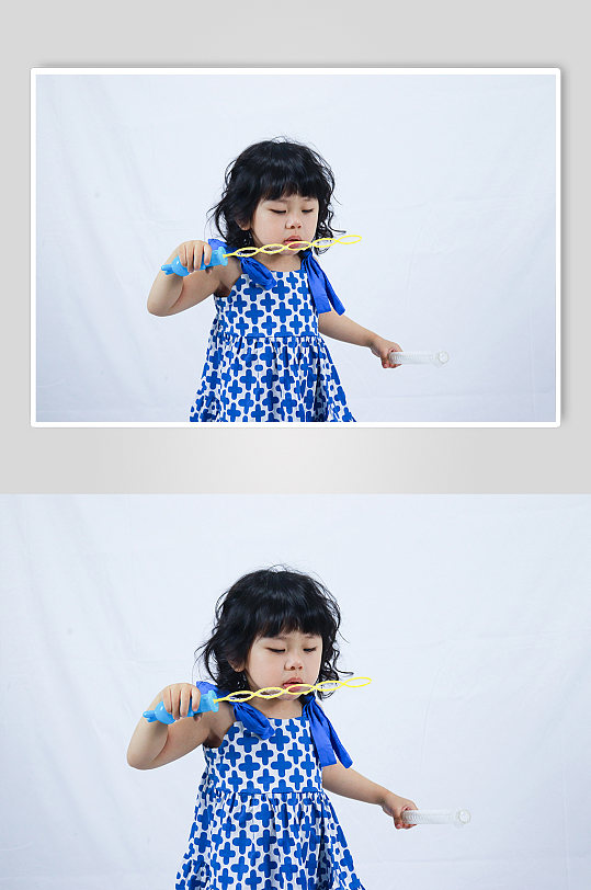 蓝裙子小女孩吹泡泡儿童节人物摄影图照片