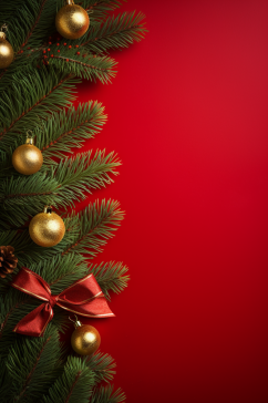 圣诞树枝金色丝带装饰红色背景摄影图