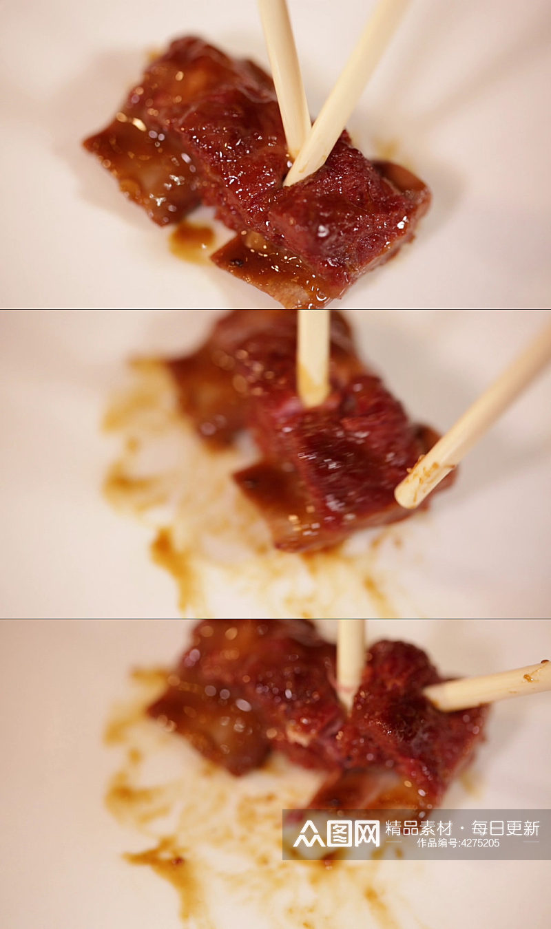 筷子夹起排骨肉实拍素材