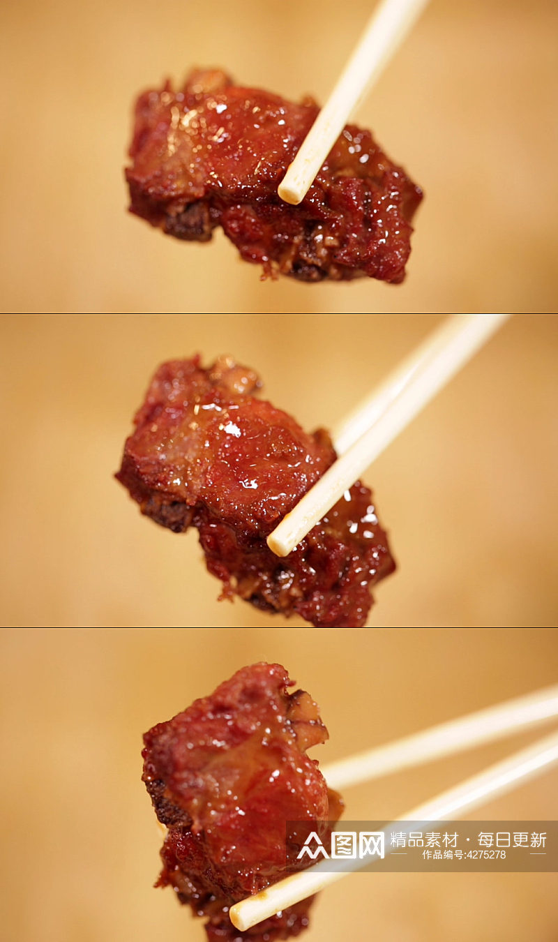 筷子夹起排骨肉实拍素材