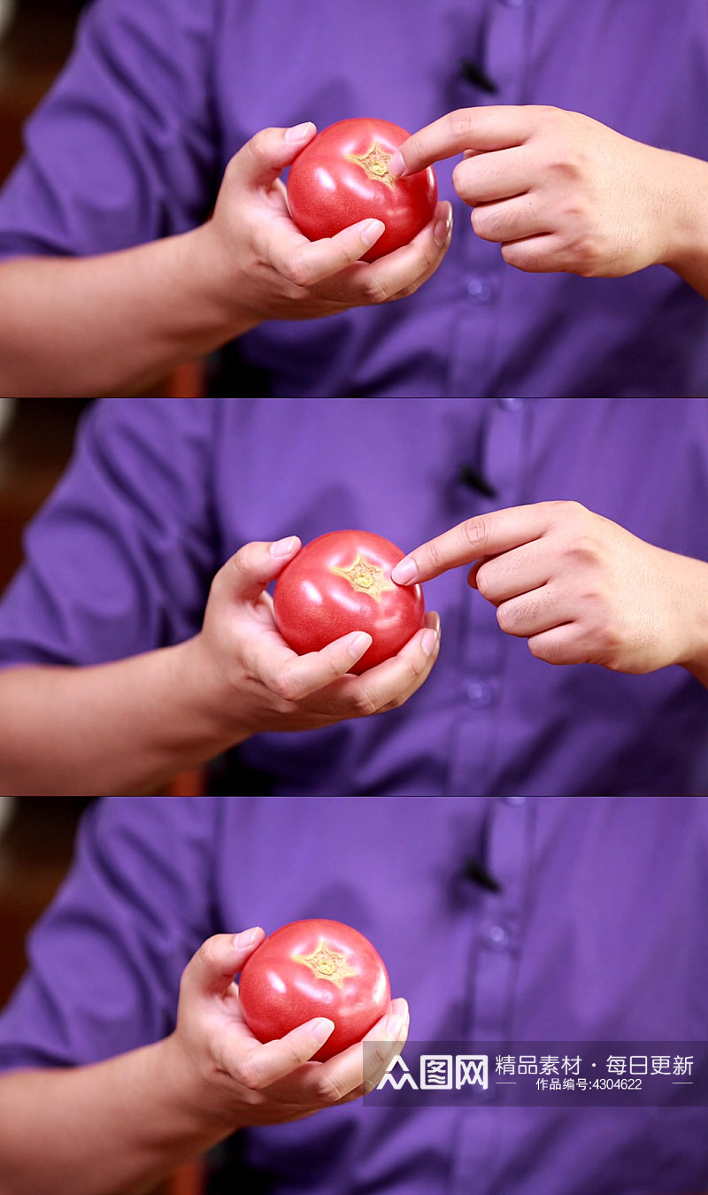 手里拿西红柿实拍素材