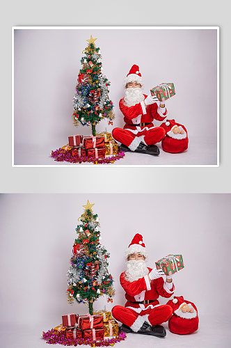 圣诞节圣诞老人展示礼物盒人物摄影图