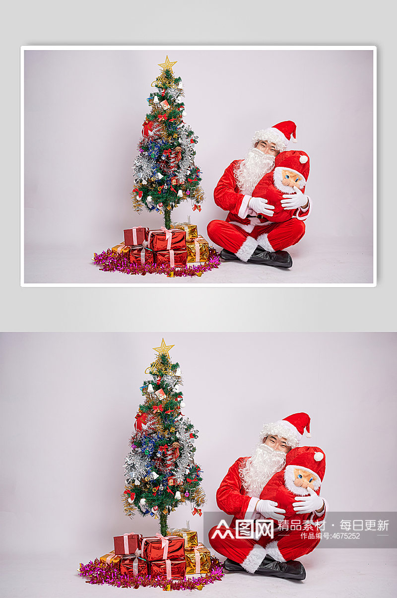 圣诞节圣诞老人坐着怀抱娃娃人物摄影图素材