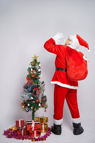 圣诞树圣诞节圣诞老人呼唤背影人物摄影图