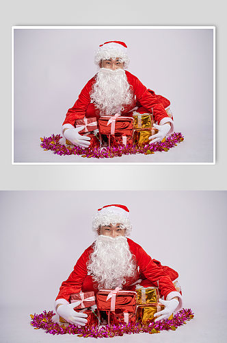 圣诞节圣诞老人坐姿拥抱礼物人物摄影图
