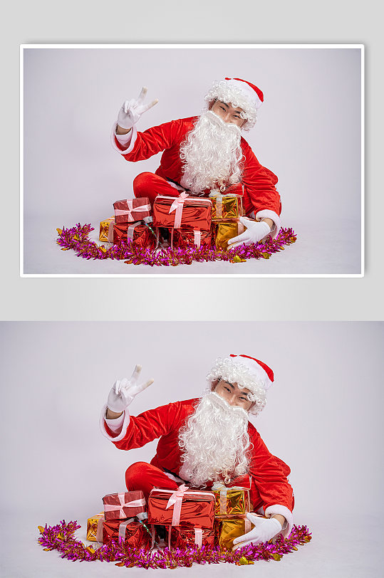 圣诞节圣诞老人坐姿胜利手势人物摄影图