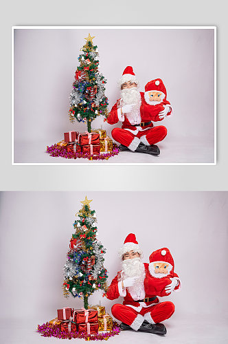 圣诞氛围圣诞老人坐着单手抱娃娃人物摄影图