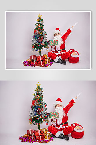 圣诞节圣诞老人展开手单手托礼物人物摄影图