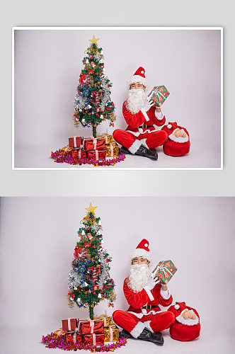 圣诞节圣诞老人双手托举礼物盒人物摄影图