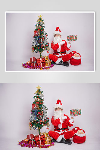 圣诞老人单手托举礼物盒人物摄影图