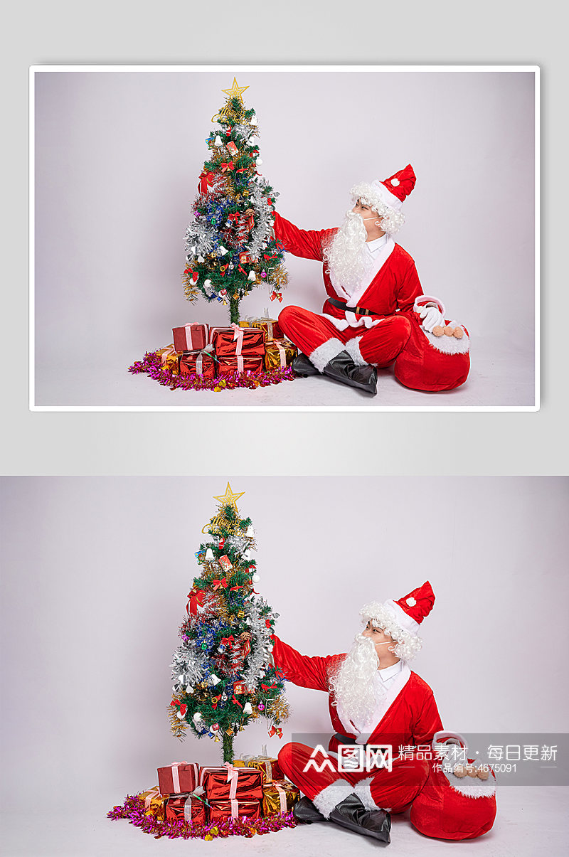 圣诞老人抬头抚摸圣诞树哦坐姿人物摄影图素材