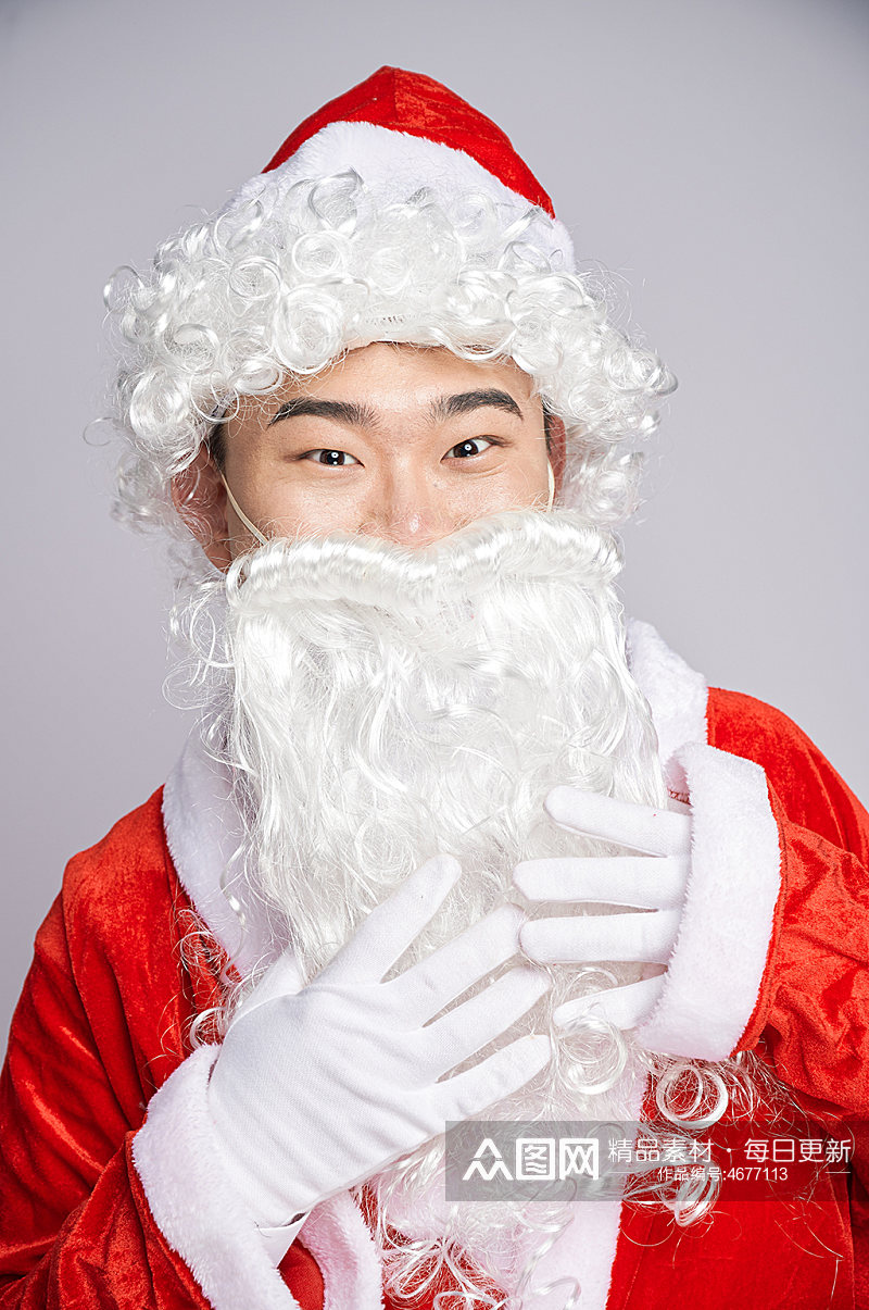 圣诞节圣诞老人抚摸胡子人物摄影图素材