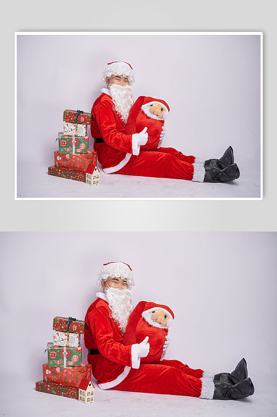 圣诞节圣诞老人坐着手抱礼物人物摄影图