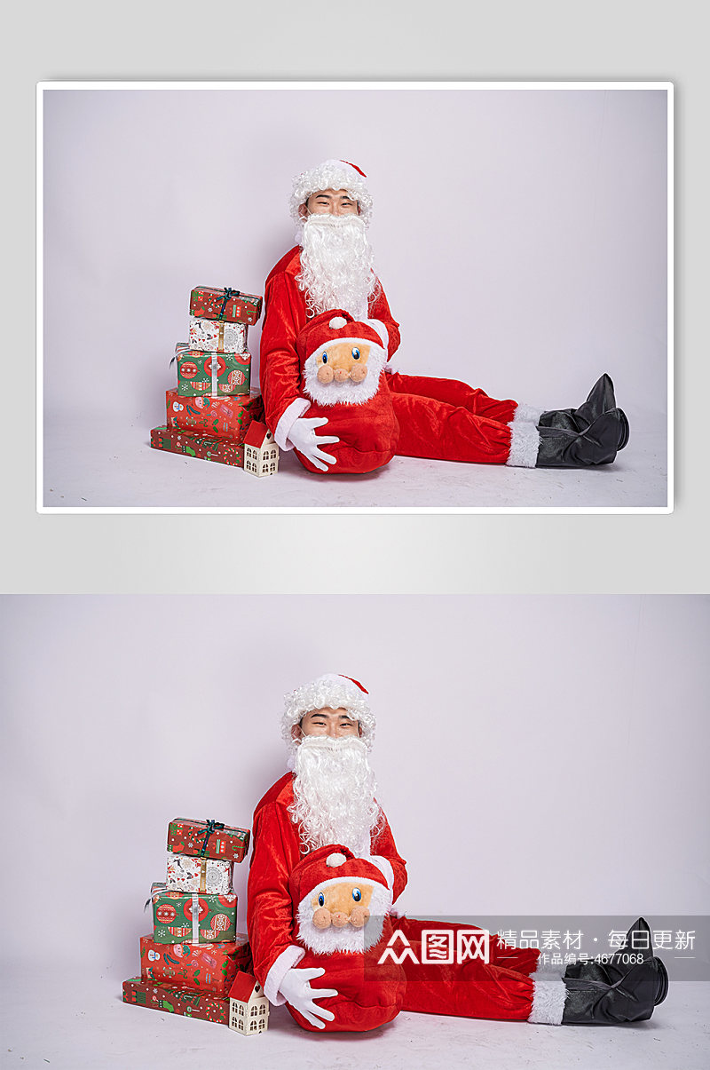 圣诞节圣诞老人坐着手抱礼物盒人物摄影图素材