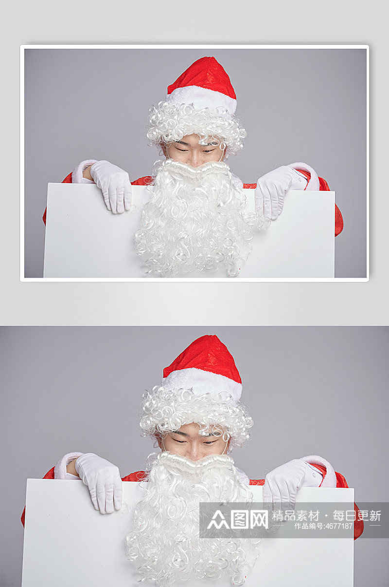 圣诞节圣诞老人低头拿纸人物摄影图素材