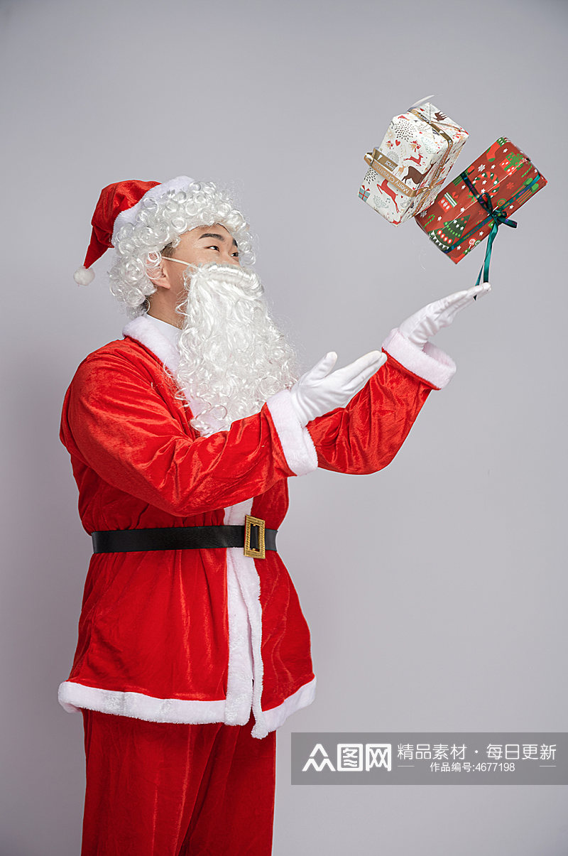圣诞节圣诞老人抛礼物盒人物摄影图素材