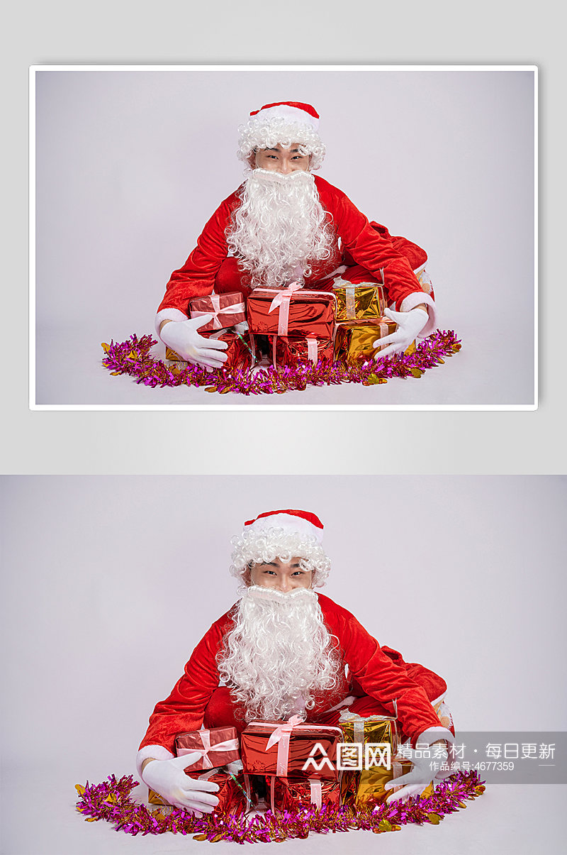 圣诞节圣诞老人蹲着抱礼物人物摄影图素材