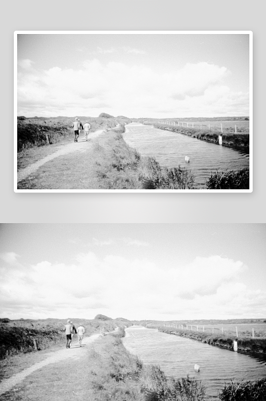 两人沿河岸小径行走-众图网