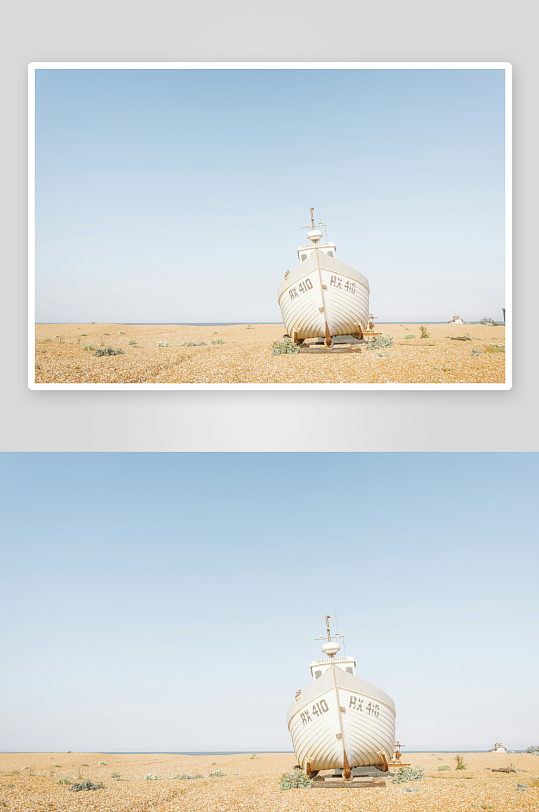 搁浅在沙滩上的白色渔船-众图网
