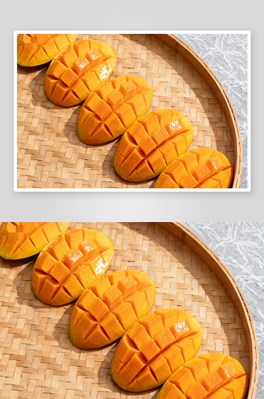 切块芒果摆放在竹编盘上-众图网