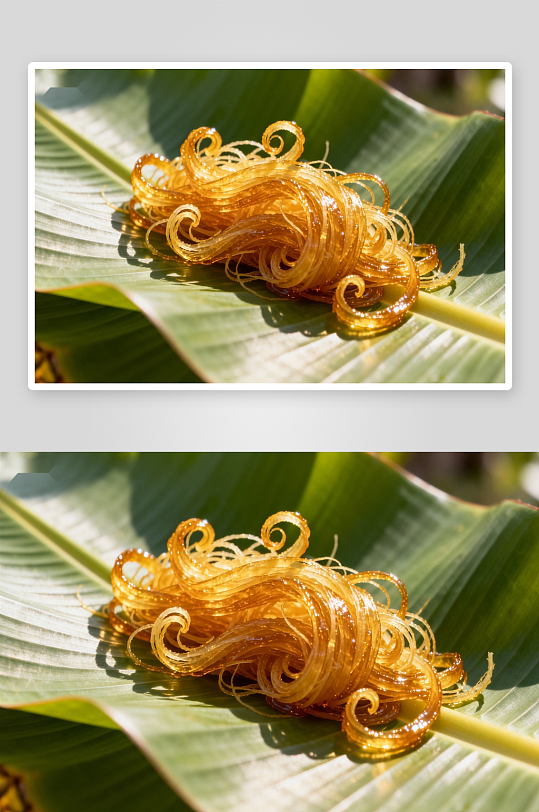 金黄色糖丝置于绿叶之上-众图网