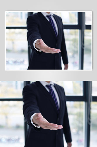 企业人物握手邀请动作摄影图照片