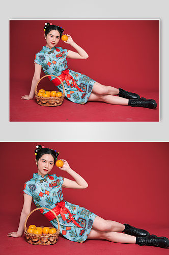 国潮女性旗袍造型水果橙子商业摄影图
