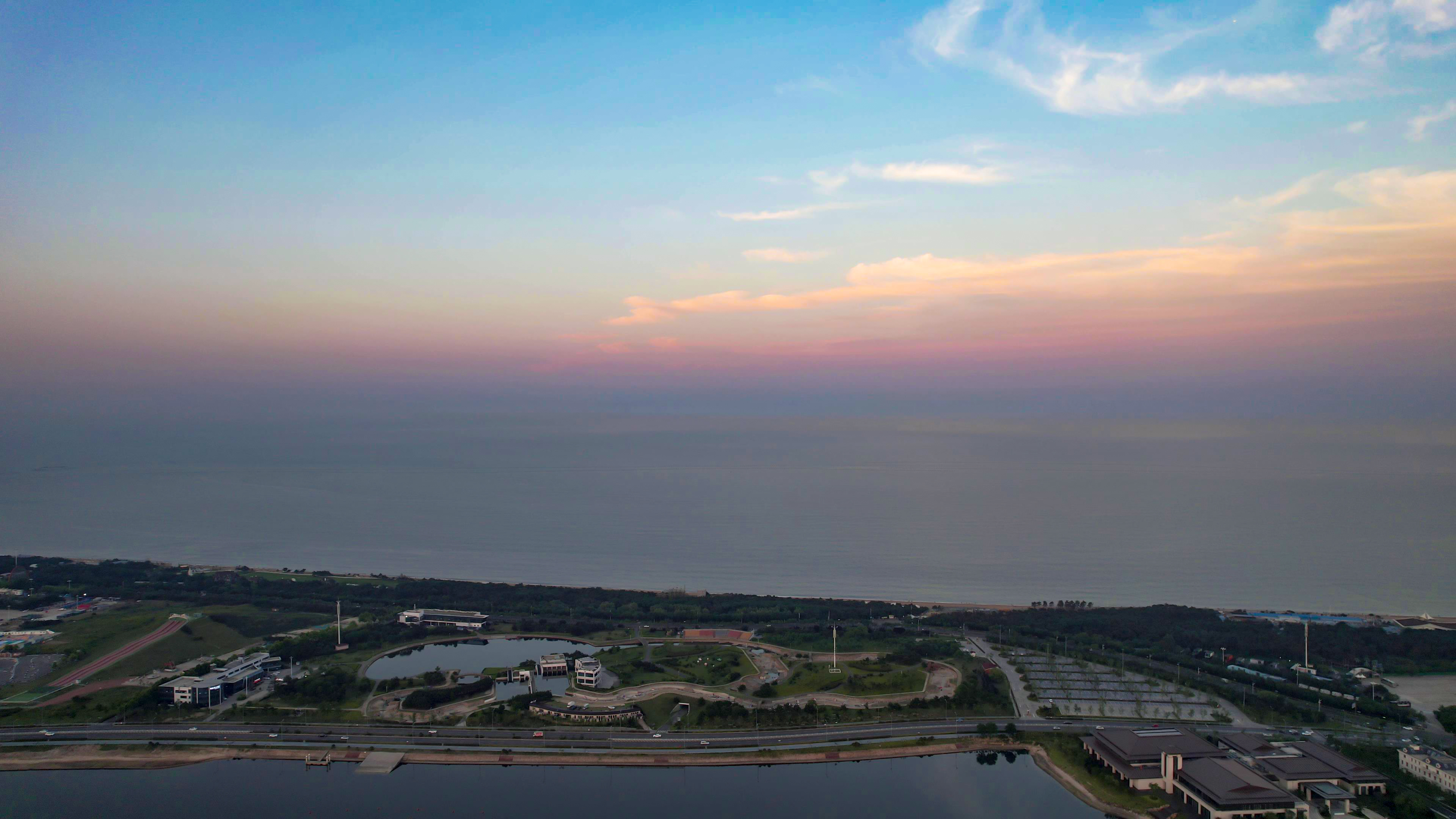 山东日照城市夕阳晚霞日落航拍素材