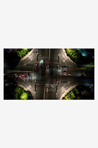 城市十字交叉路口交通车辆行驶夜景航拍摄影