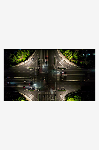 城市十字交叉路口交通车辆行驶夜景航拍摄影