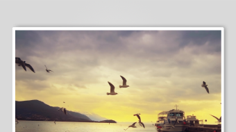 黄昏湖畔飞鸟与停泊船只-众图网