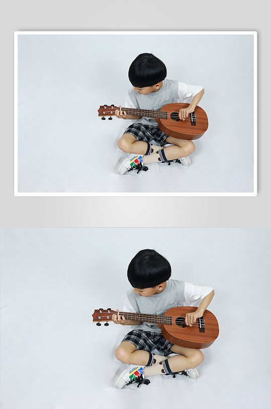 认真弹尤克里里男孩学生儿童节人物摄影照片