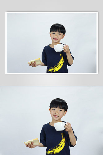吃早餐牛奶面包男孩学生儿童节人物摄影照片